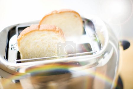 Photo for Fresh homemade bread on the kitchen table - Royalty Free Image