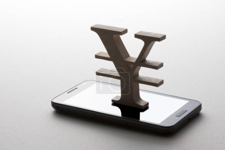 Foto de Yen japonés símbolo de moneda y teléfono inteligente. Representación 3 d - Imagen libre de derechos
