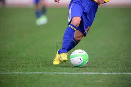 Foto de Fútbol fútbol jugador de acción en el estadio - Imagen libre de derechos