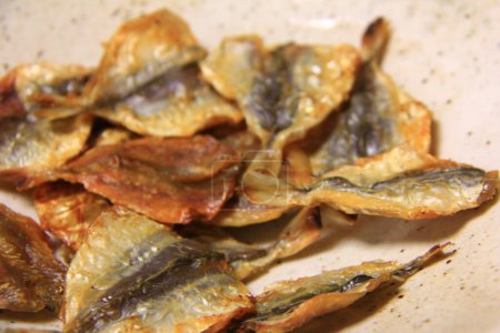 Photo for Salted fried fish on background, close up - Royalty Free Image