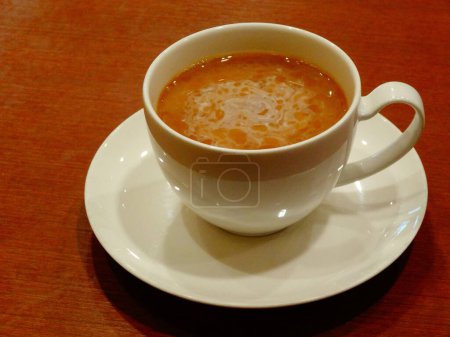 Photo for Cup of coffee with milk on table, close-up view - Royalty Free Image