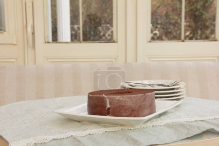 Photo for Sweet and delicious chocolate cake on plate - Royalty Free Image