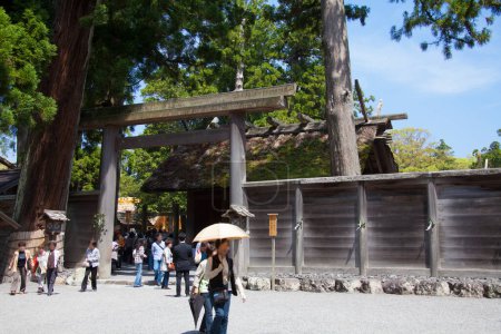 Photo for Scenic shot of beautiful ancient Japanese shrine with visitors - Royalty Free Image