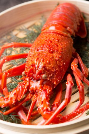Photo for Close-up view of delicious seafood. lobster cooking in bamboo bowl - Royalty Free Image