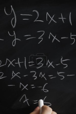 Photo for Hand writing math formulas on chalkboard - Royalty Free Image