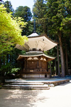 Photo for Scenic shot of beautiful ancient Japanese shrine surrounded with forest trees - Royalty Free Image