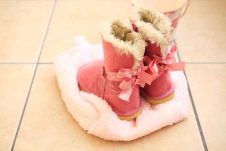 cute pink ugg boots on the floor