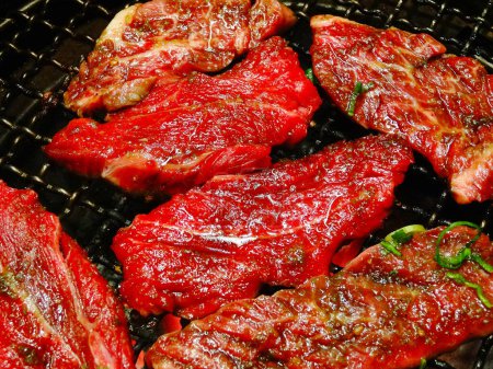 Photo for Close-up view of fresh delicious meat cooking on grill - Royalty Free Image