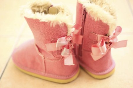 Photo for Pink ugg boots on the floor - Royalty Free Image