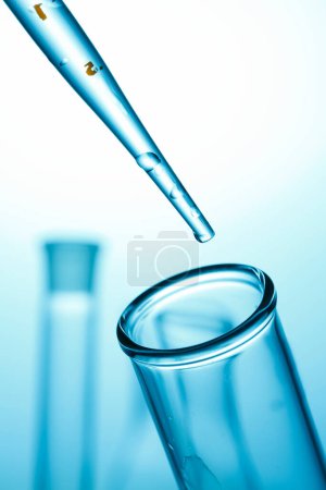 Photo for Laboratory glassware on blue background. chemical test in the laboratory, science concept - Royalty Free Image