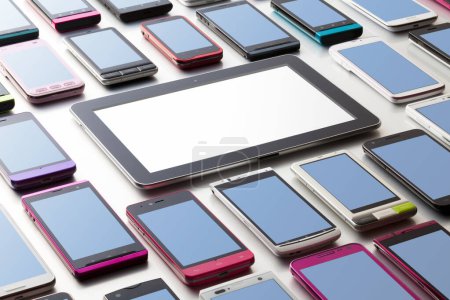 Photo for Close-up view of different modern smartphones and digital tablet on grey background. - Royalty Free Image