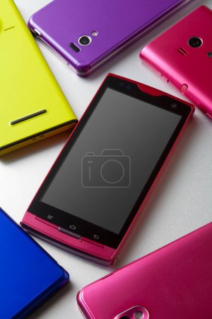 Photo for Close-up view of various modern smartphones on white background - Royalty Free Image