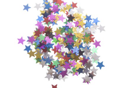 Photo for Festive colorful star-shaped confetti on white background - Royalty Free Image