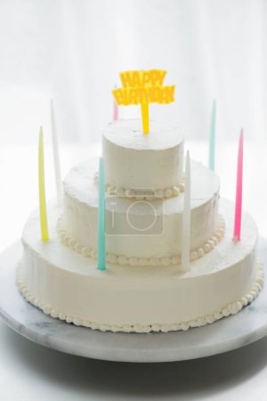 Photo for Birthday cake with cream and candles on table - Royalty Free Image