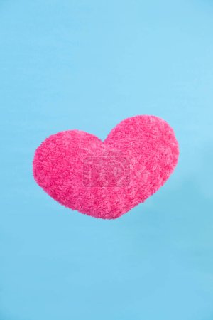Photo for Beautiful pink heart on a blue background. - Royalty Free Image