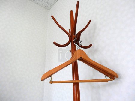 Photo for Hanger with clothes hanger on the wall - Royalty Free Image