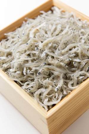 Photo for Pile of fast stir-fried anchovies fish in box - Royalty Free Image
