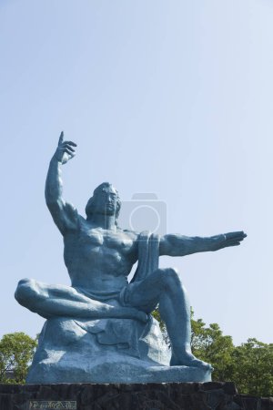 Photo for The Peace Statue of Seibo Kitamura in Nagasaki Peace Park depicting a Japanese man reminder of the consequences of nuclear warfare and calling for nuclear disarmament. - Royalty Free Image