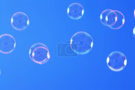 Photo for Soap bubbles on bright blue background - Royalty Free Image