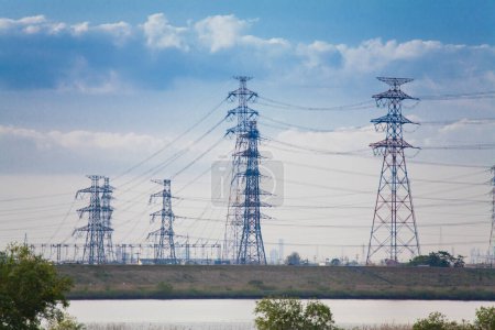 Photo for Electric power lines in the middle of the fields - Royalty Free Image