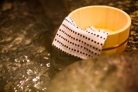 Photo for Close up view of pail and towel at hot springs, Japan - Royalty Free Image