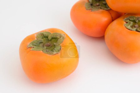 Photo for Ripe persimmons on white background. - Royalty Free Image