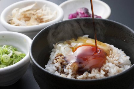 Photo for Bowl of tasty rice with raw egg and fresh vegetables, traditional Japanese cuisine - Royalty Free Image