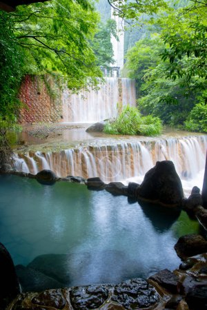 Open-air bath with waterfall view. Yamakawa onsen in Japan