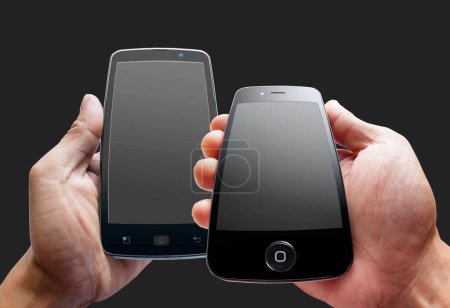 Photo for Two male hands holding smartphone with black screen against black background - Royalty Free Image