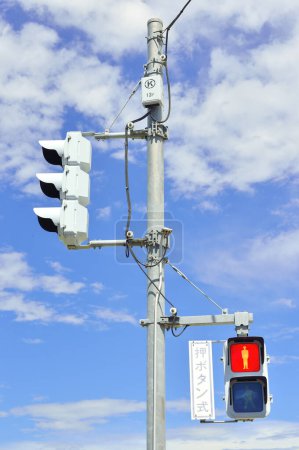 Photo for Traffic light against blue sky - Royalty Free Image