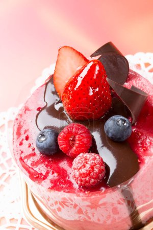 Photo for A cake with chocolate and berries on top - Royalty Free Image