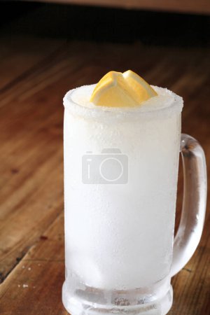 Photo for Cold lemonade and ice cubes and lemons - Royalty Free Image