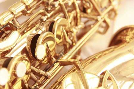 Photo for Close up of saxophone on light background, musical instrument - Royalty Free Image