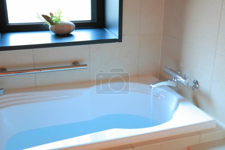 Photo for Modern white bathroom with water and sink - Royalty Free Image