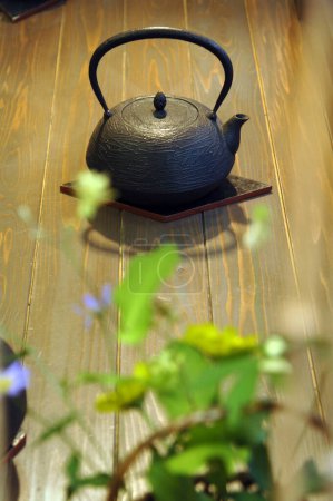 Photo for Tea ceremony, tea pot and green leaves - Royalty Free Image