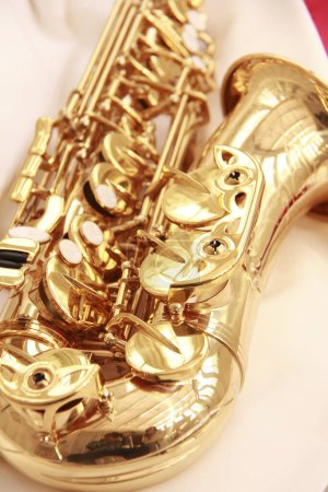 Photo for Close up of saxophone on light background, musical instrument - Royalty Free Image