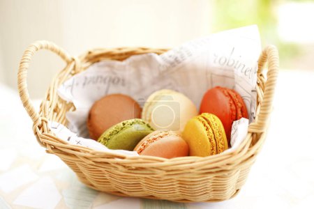 Photo for Close-up view of delicious colorful macarons in basket - Royalty Free Image