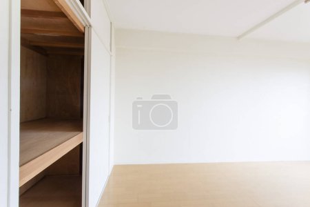 Photo for Empty room with wooden floor, wardrobe - Royalty Free Image