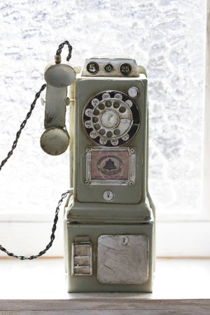 Photo for Old telephone on windowsill background, close up - Royalty Free Image