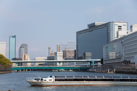 Dojima River (Kyu-Yodo River) and modern city architecture in Kita-ku, Osaka, Japan