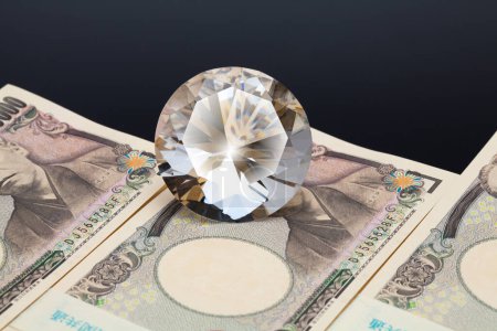 Photo for Japanese currency, pile of yen banknotes with diamond - Royalty Free Image