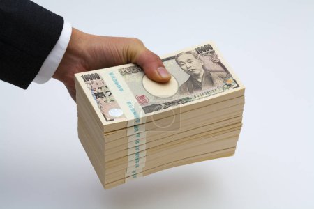 Foto de Mano masculina de dinero yen japonés, primer plano - Imagen libre de derechos