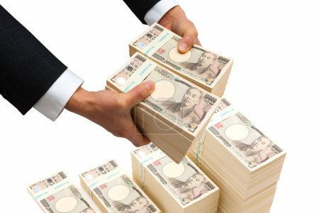 Téléchargez les photos : Mains masculines tenant japonais yen argent sur fond - en image libre de droit