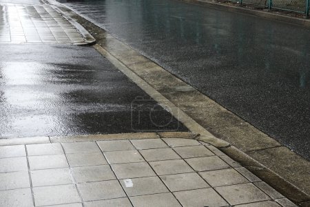 Photo for Rain drops after rain on a sidewalk - Royalty Free Image