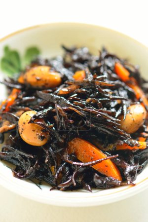 Photo for Asian traditional food, stir-fried seaweeds with beans and carrots - Royalty Free Image