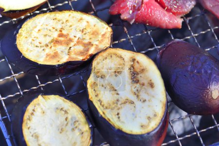 Photo for Barbecue with meat and eggplant pieces on grill - Royalty Free Image