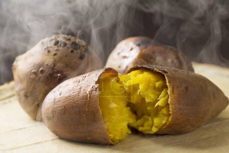 Japanese roasted sweet potatoes on background, close up