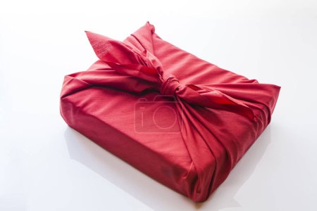 Photo for Present wrapped in a furoshiki on white background - Royalty Free Image