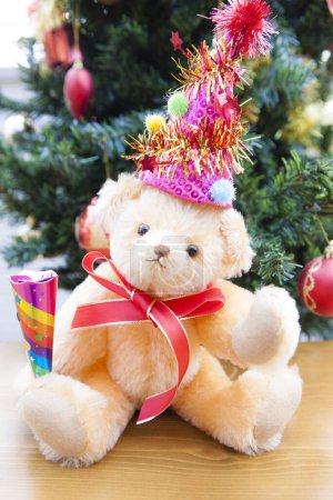 Photo for Teddy bear with a christmas hat - Royalty Free Image