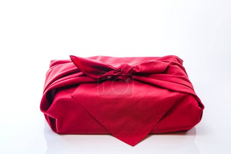 Present wrapped in a furoshiki on white background